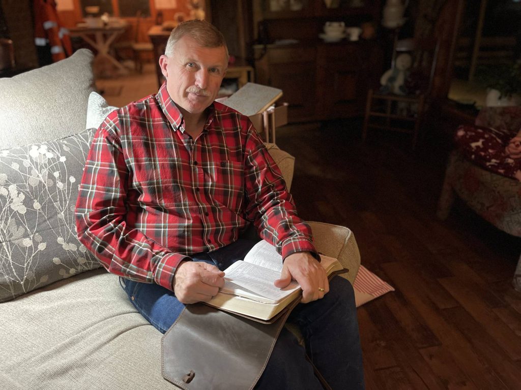 Sam reads the Christmas story from the Bible