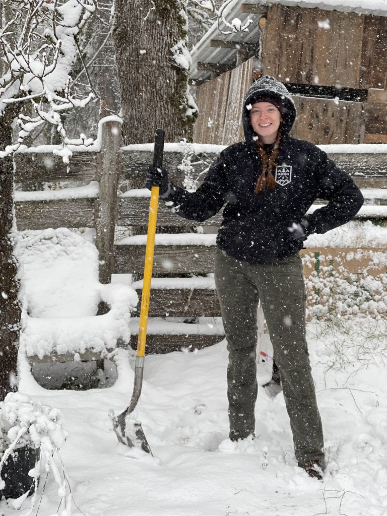 Miriam shovels snow