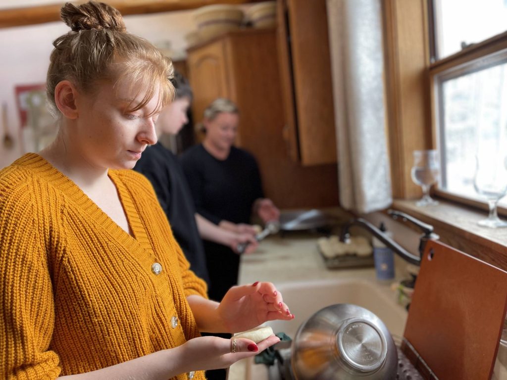 Miriam pats dough before rolling lefse