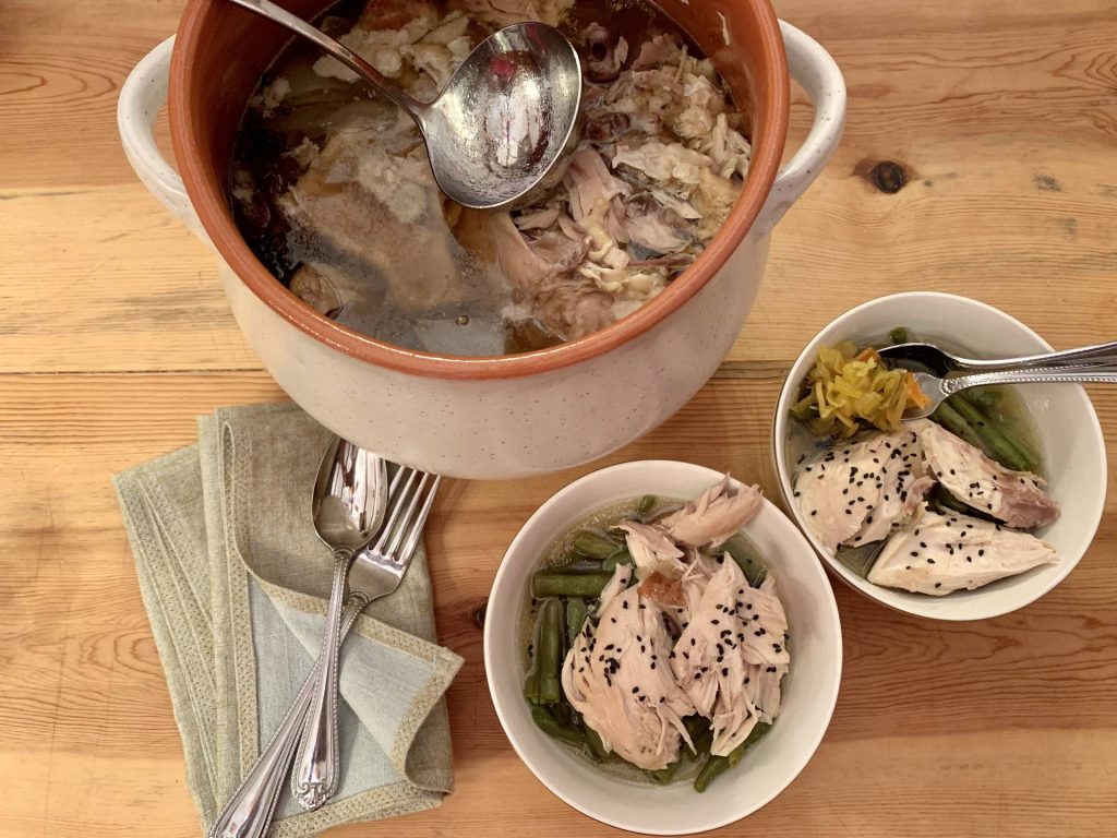 whole poached chicken on the wood stove