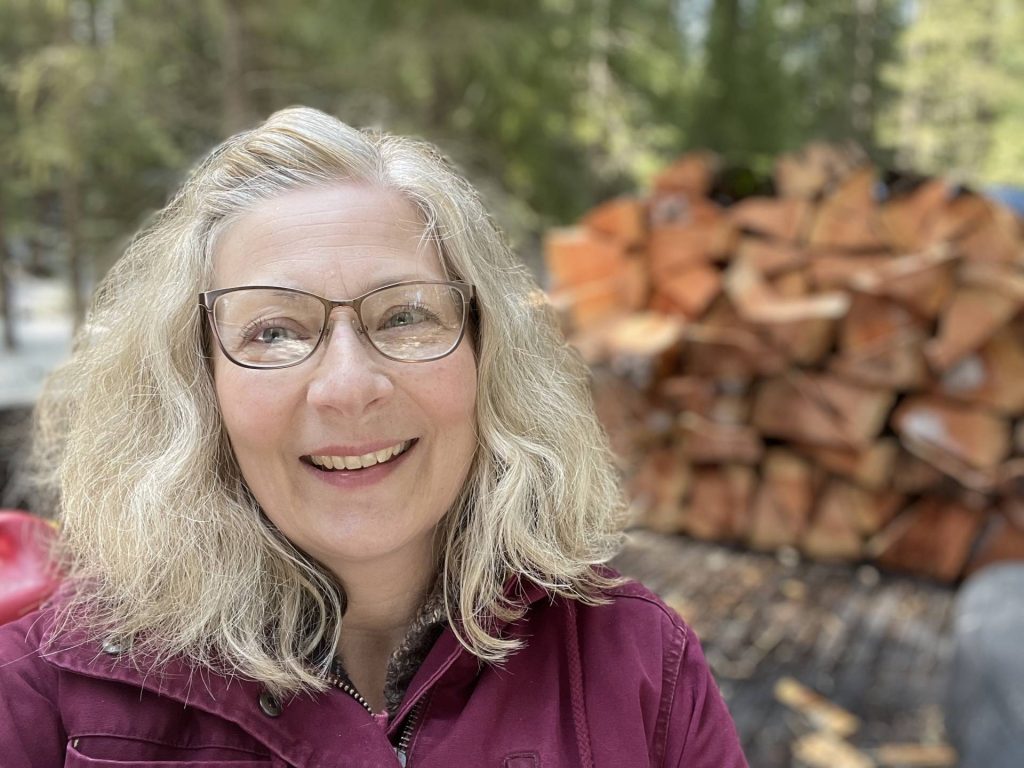 Michele Pryse stacks wood