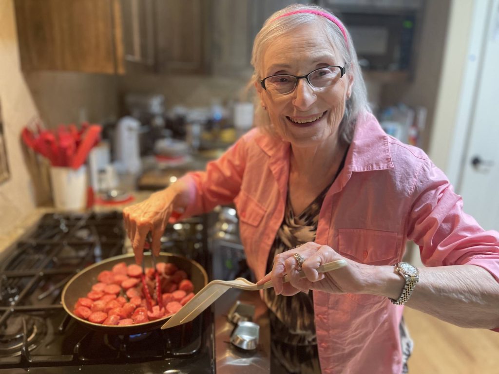 Mom cooks the sausage