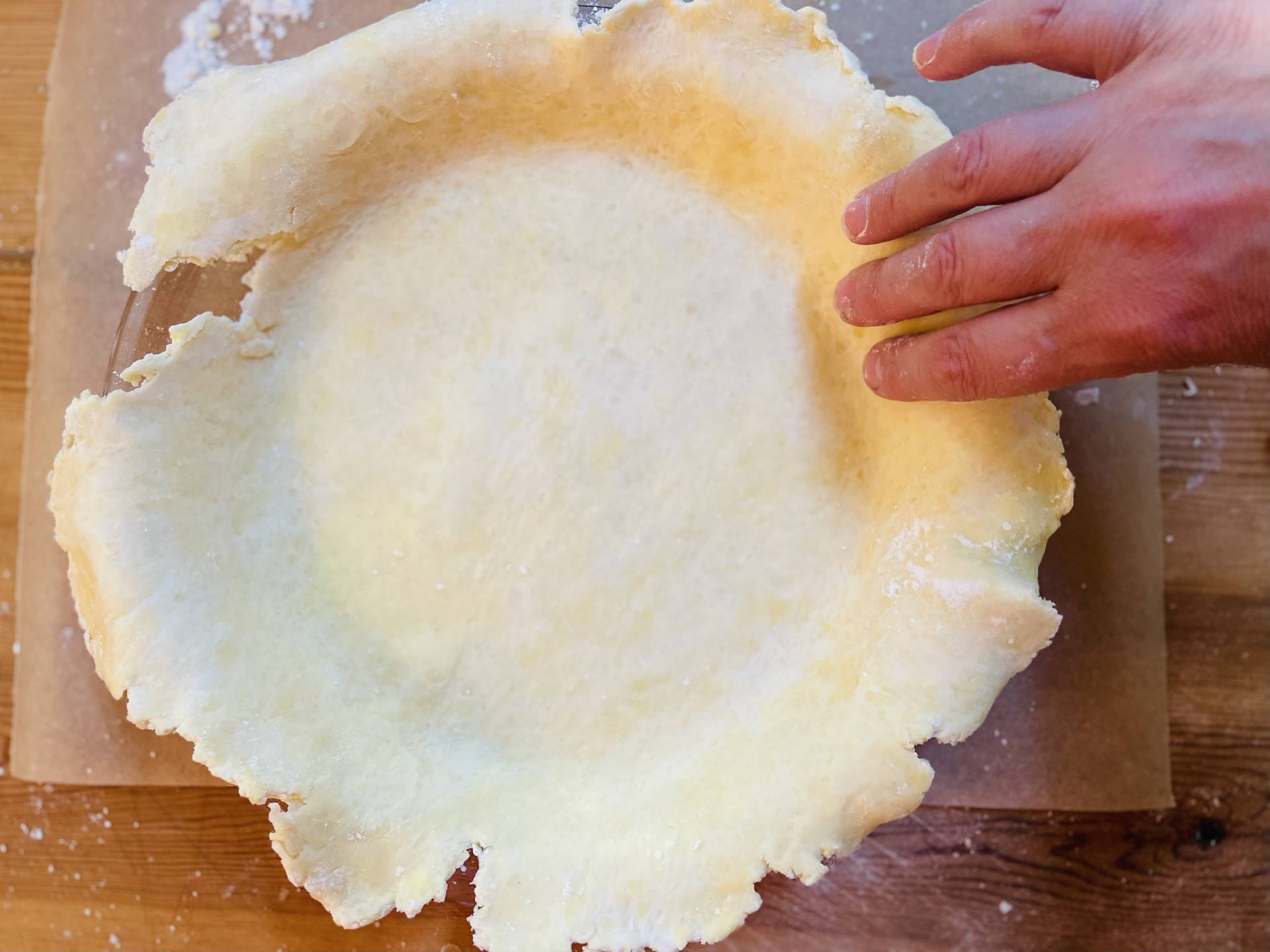 settling pie crust in dish