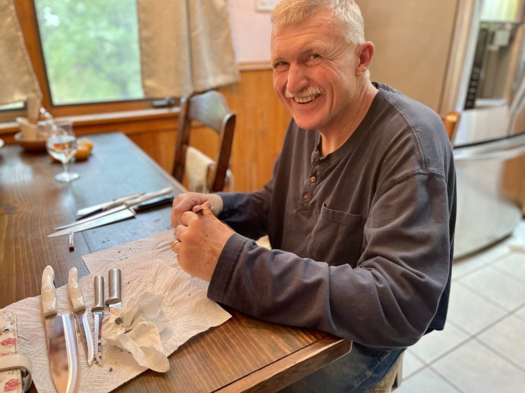 Samuel sharpening kitchen knives