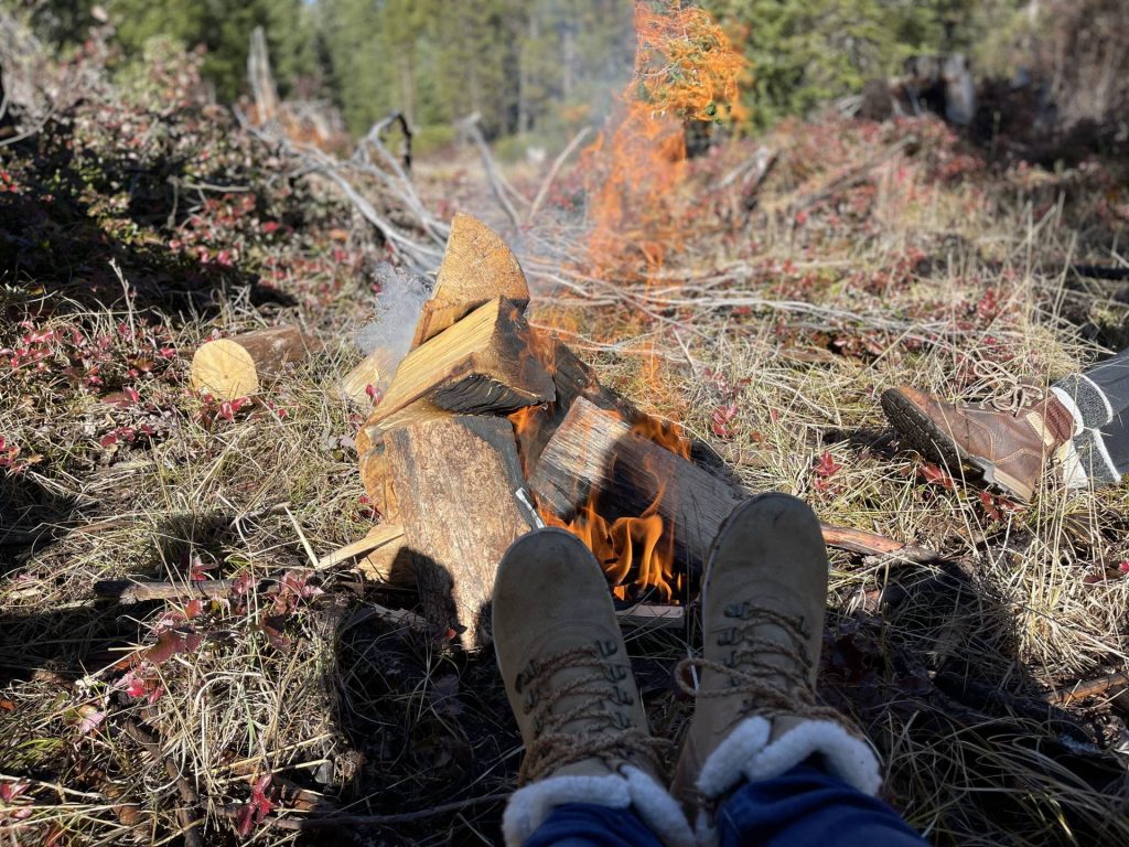 Warming boots at the fire