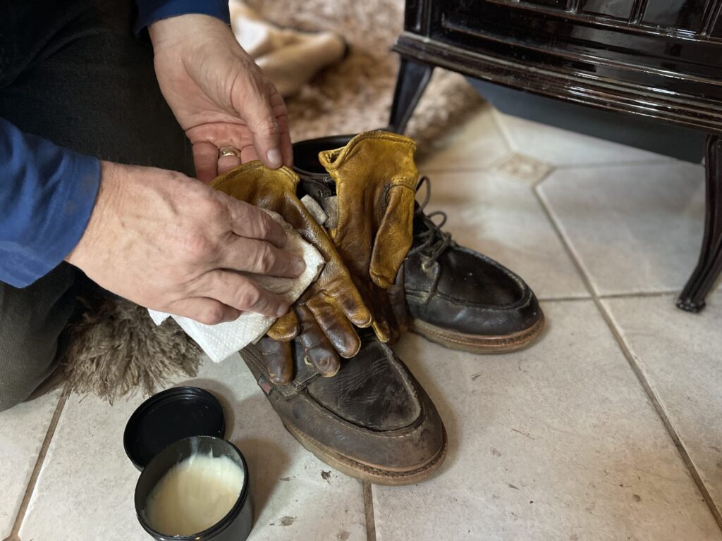 Sam oiling boots and gloves