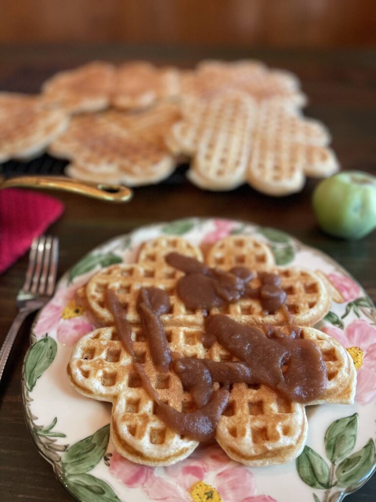 Crock Pot apple butter over heart-shaped waffles