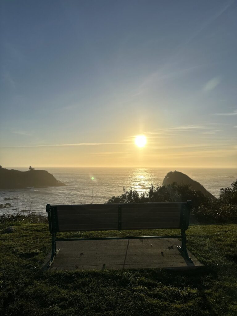 Pete Happ trail bench at sunset in Brookings Oregon